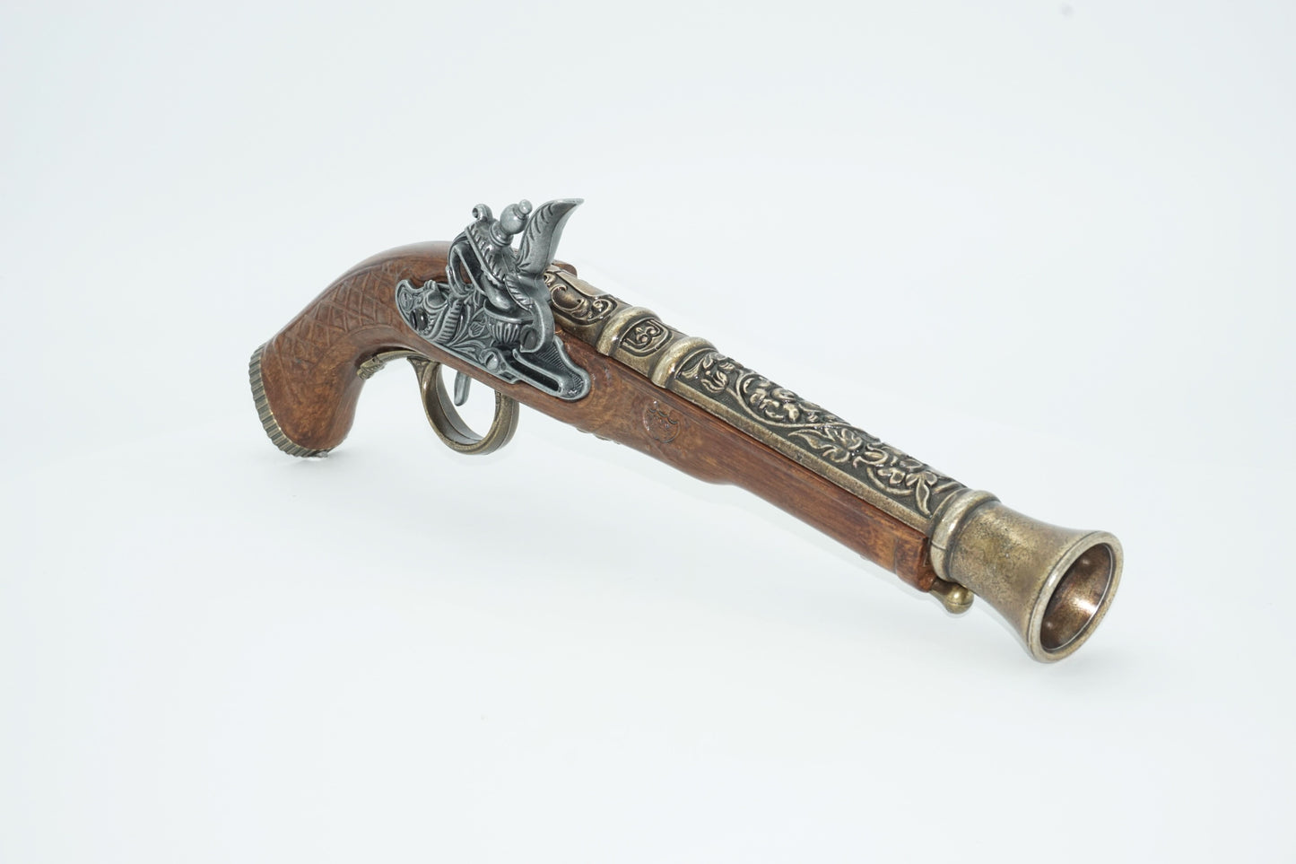 Right front view of dueling pistol with brass barrel and silver firing pin. This pistol comes in a set of two and a cardboard decorative display box not shown.