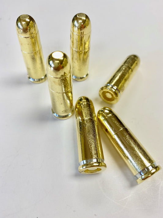 Six Winchester Rifle fake brass bullets three on their side three standing