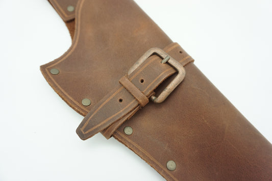 Close up view of leather left hand replica colt holster with brass buckle
