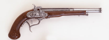 Single pirate pistol closeup, wood grip and pewter toned firing mechanism. 