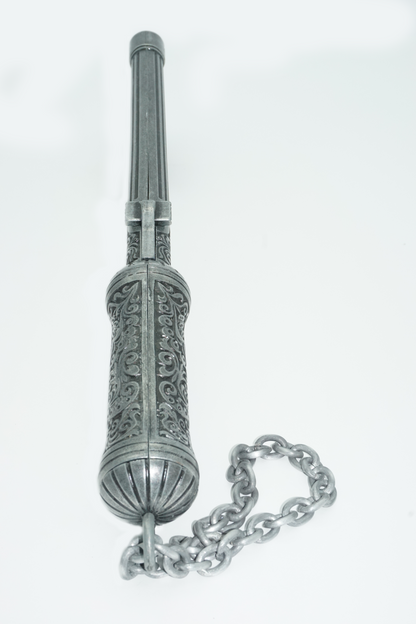 Butt end of ottoman pistol axe with intricate carvings and a chain to carry it.