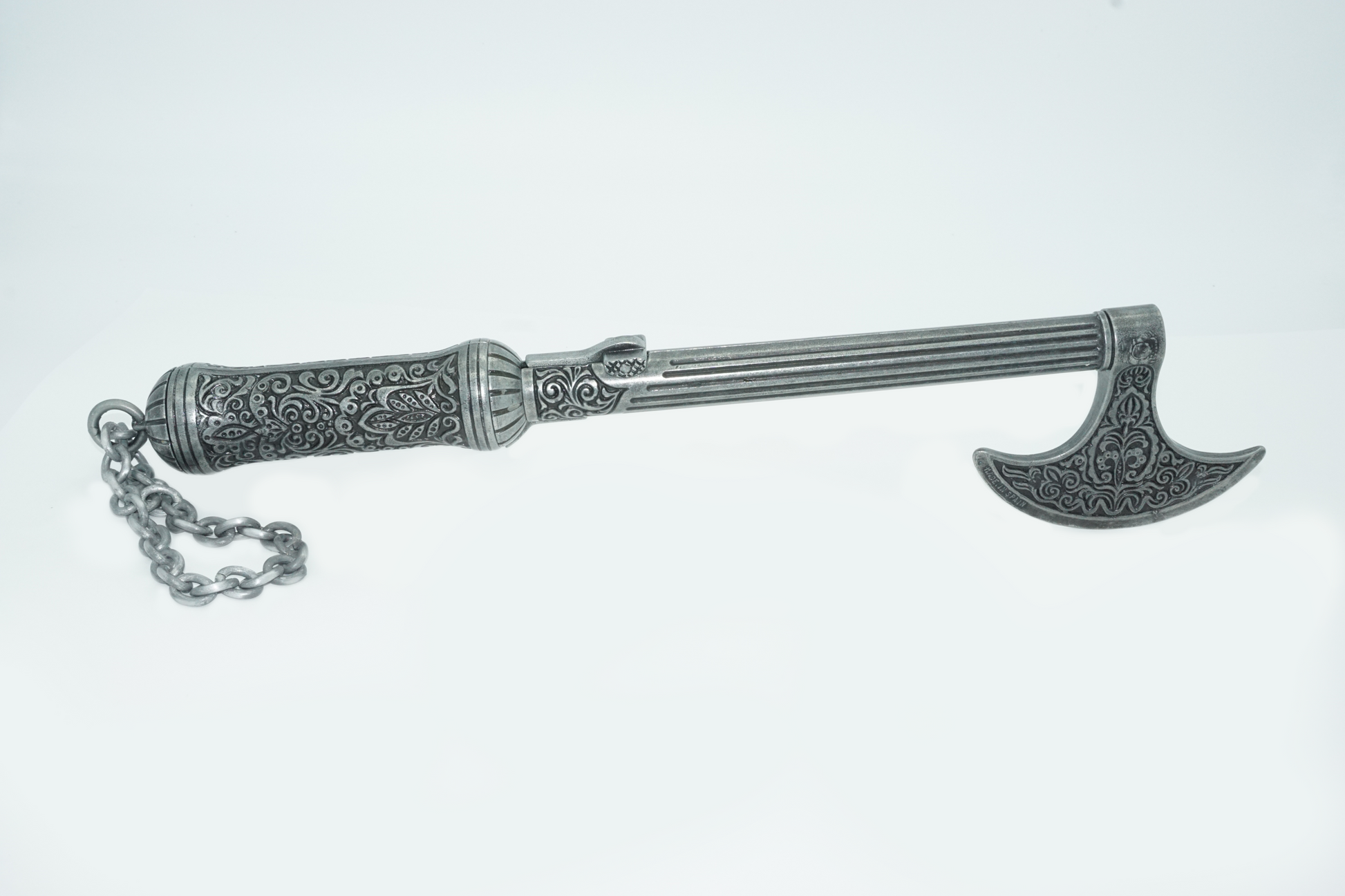 Full side view of ottoman axe pistol including the barral which also acts as the main shaft of the axe.