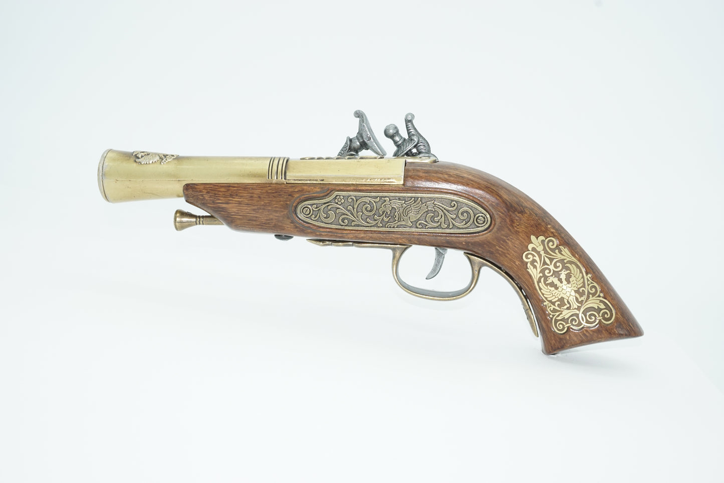 Left side of the german flintlock pistol in brass, silver and wood. 