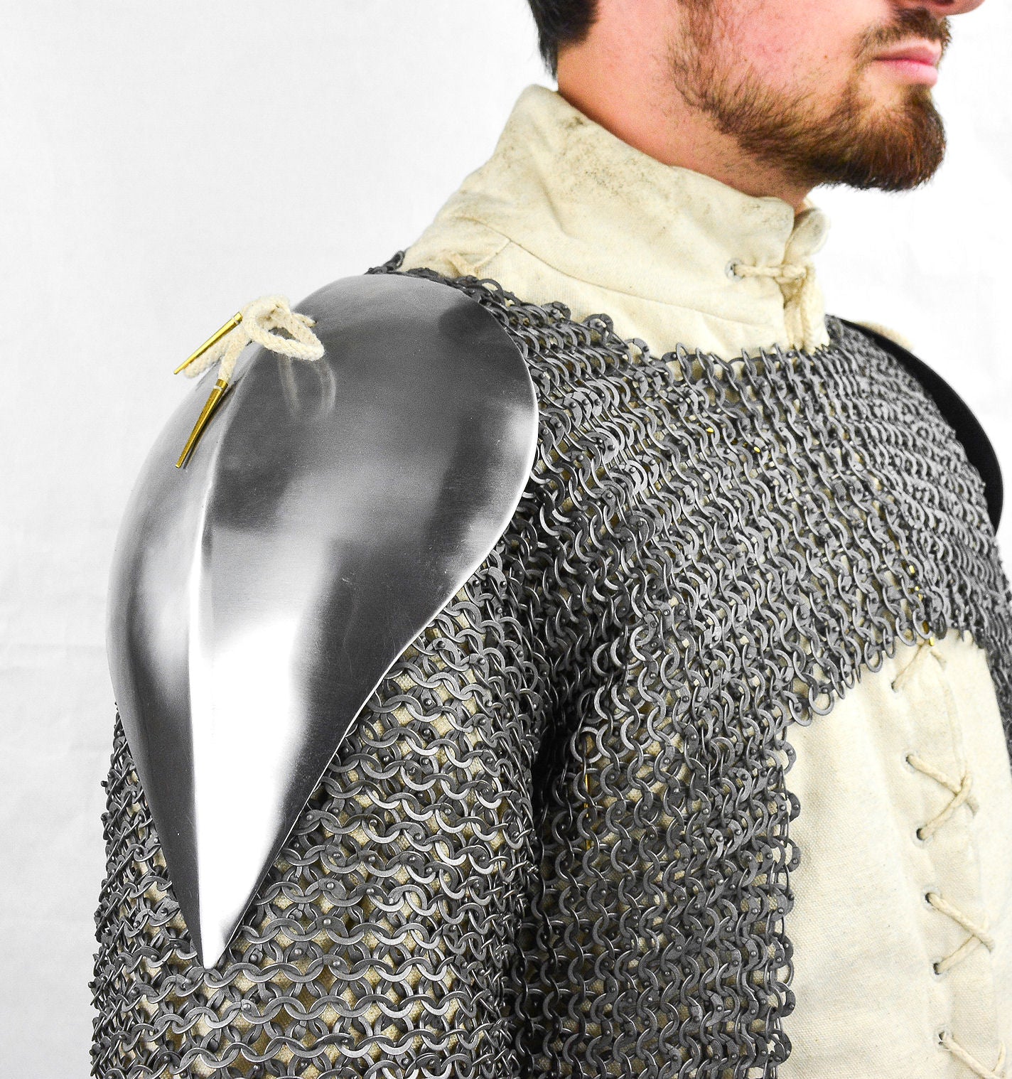man wearing Visby shoulder pauldrons