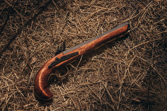 Flintlock laying on a forest floor