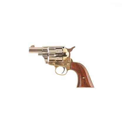 Left side view of polished nickel Non-Firing 1873 .45 Caliber Short Revolver with brass trigger guard and accents and wood grip.