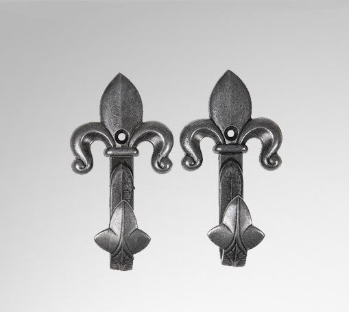 One pair of pewter sword or pistal wall hangers with fleur de lis on the top