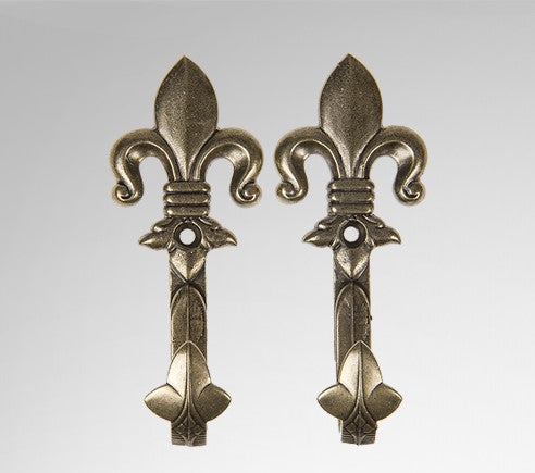 One pair of brass fleur de lis pistol or sword hanger.