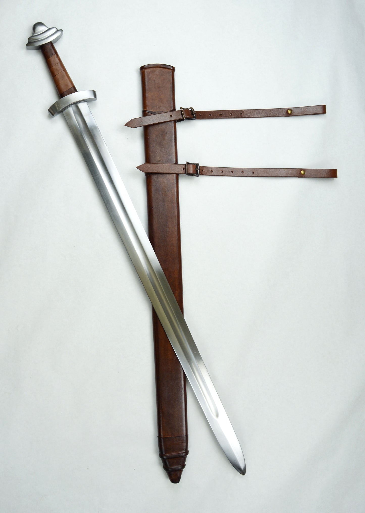 11th Century Viking Sword  with acorn pommel and leather sheath. Sword is pictured outside sheath