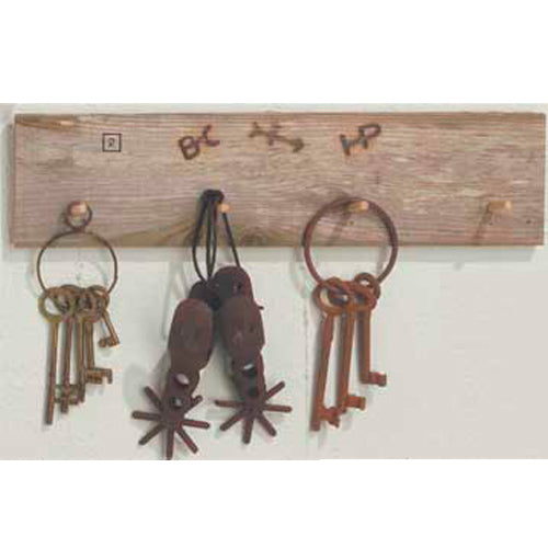 Western Pegged Board with three old key sets hanging