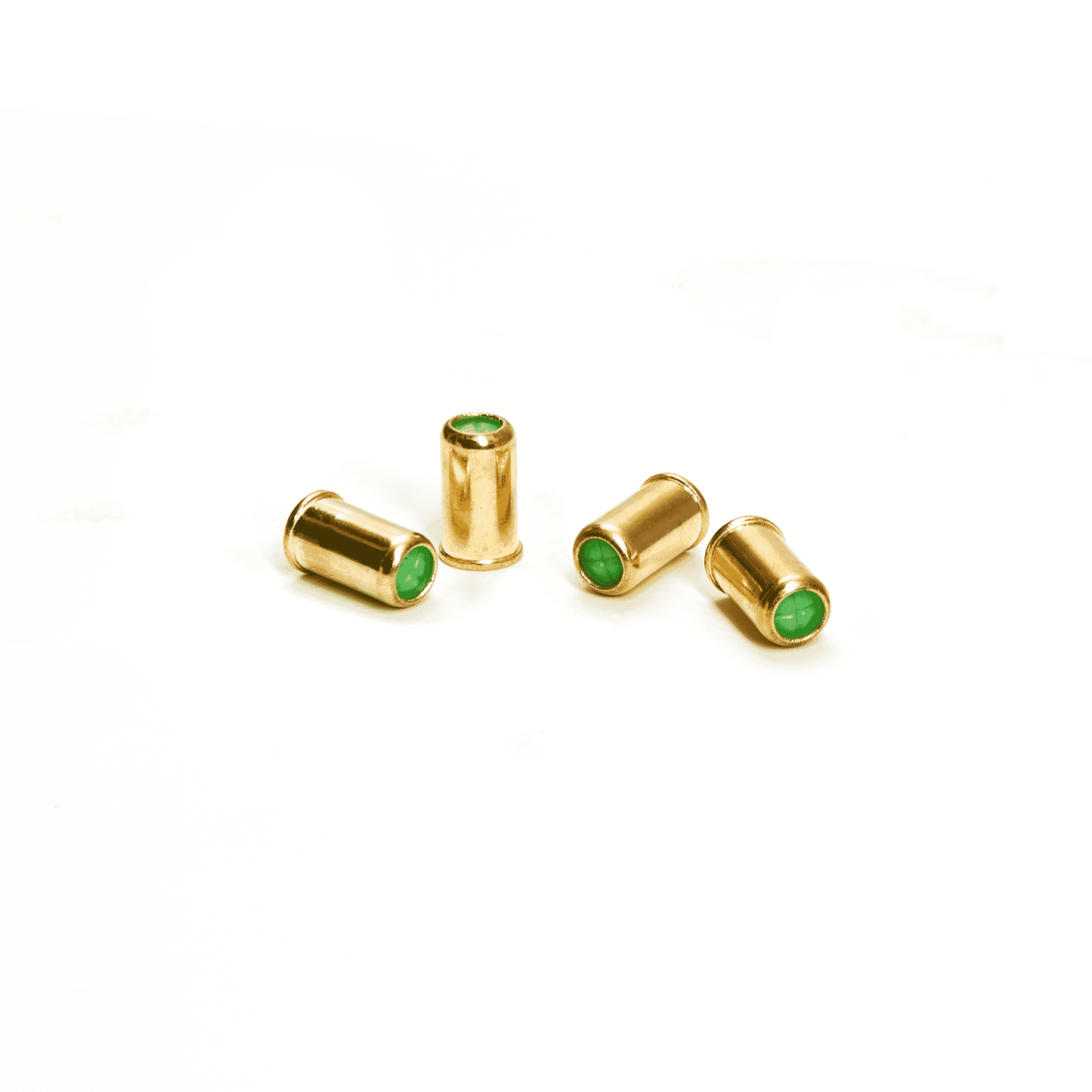 picture of the brass cased blank bullets with green end