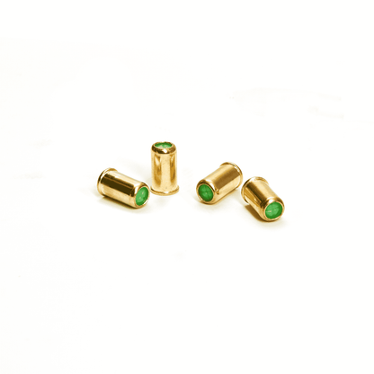 picture of the brass cased blank bullets with green end