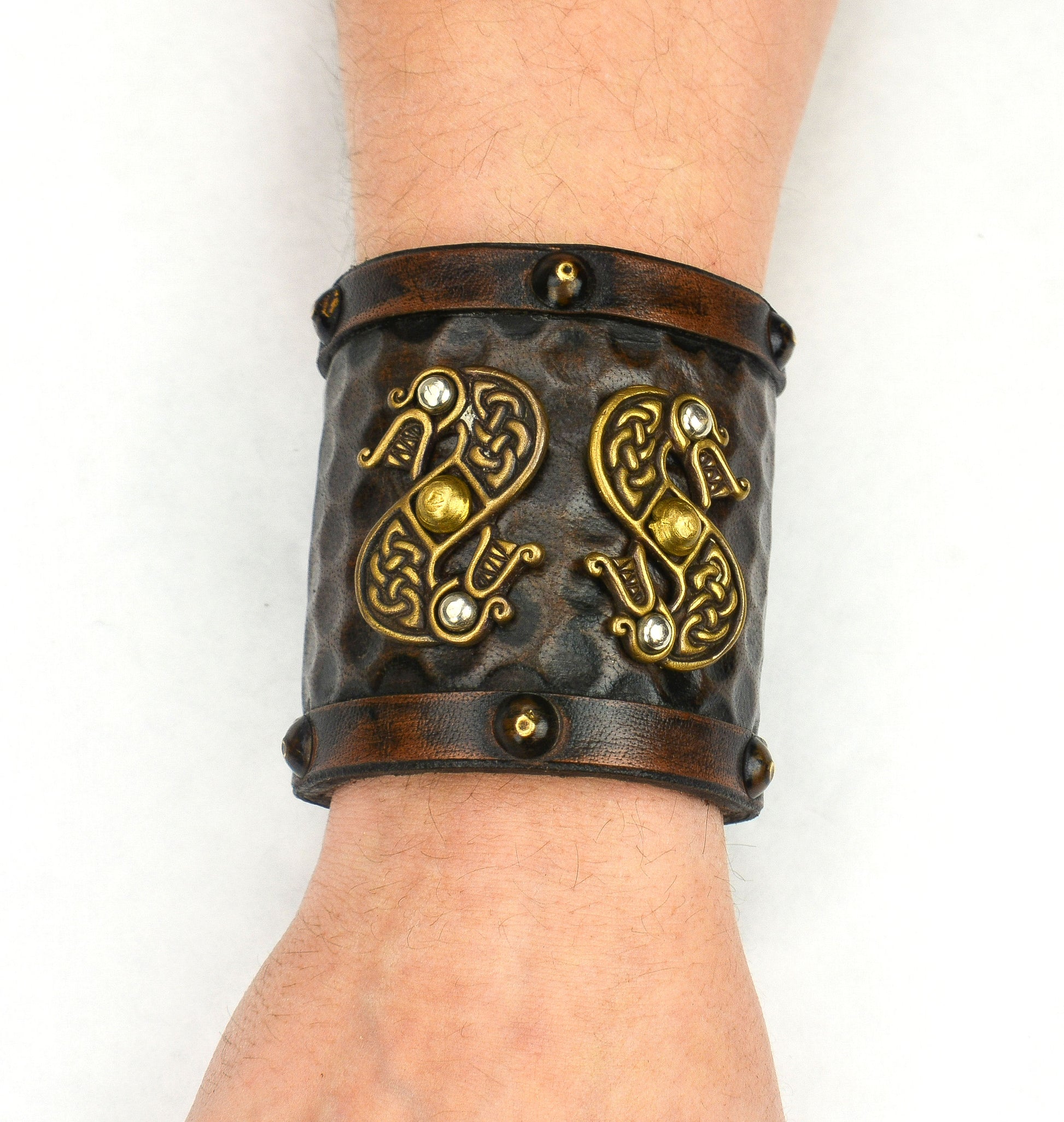 Viking Leather Cuff with Norse Serpents on a wrist