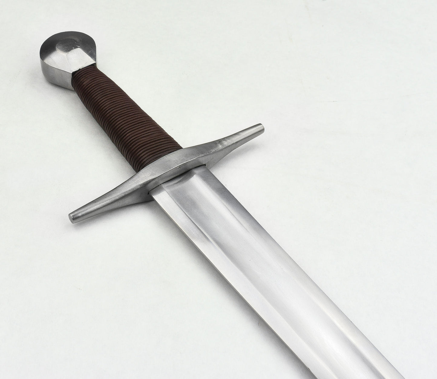 Angle view of 11th Century Viking Sword with closeup of leather grip and round pommel outside of sheath