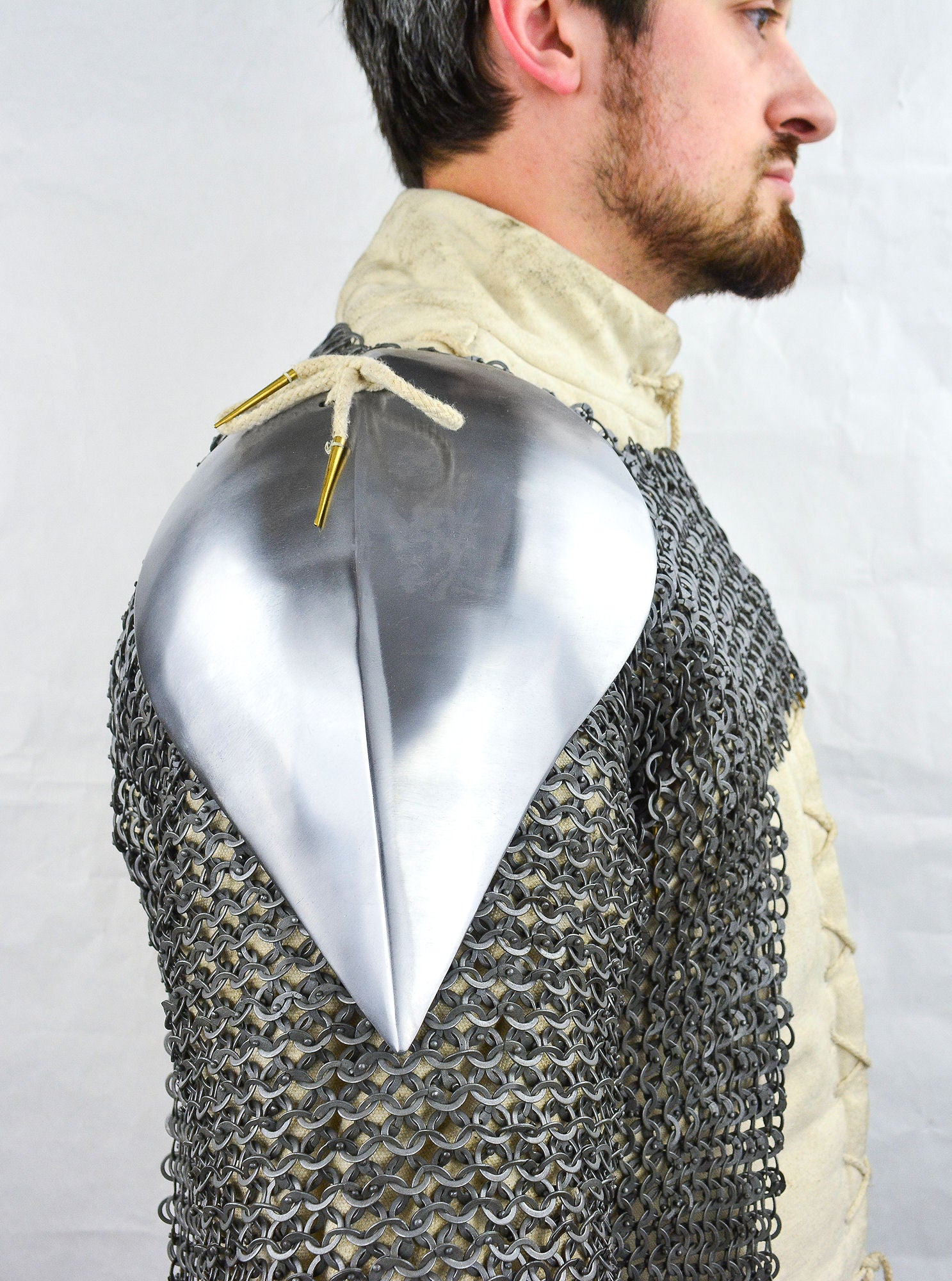 man wearing Visby shoulder pauldrons